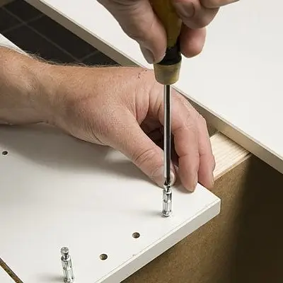 image of a flat pack being assembled to represent the category of flat pack furniture assembly